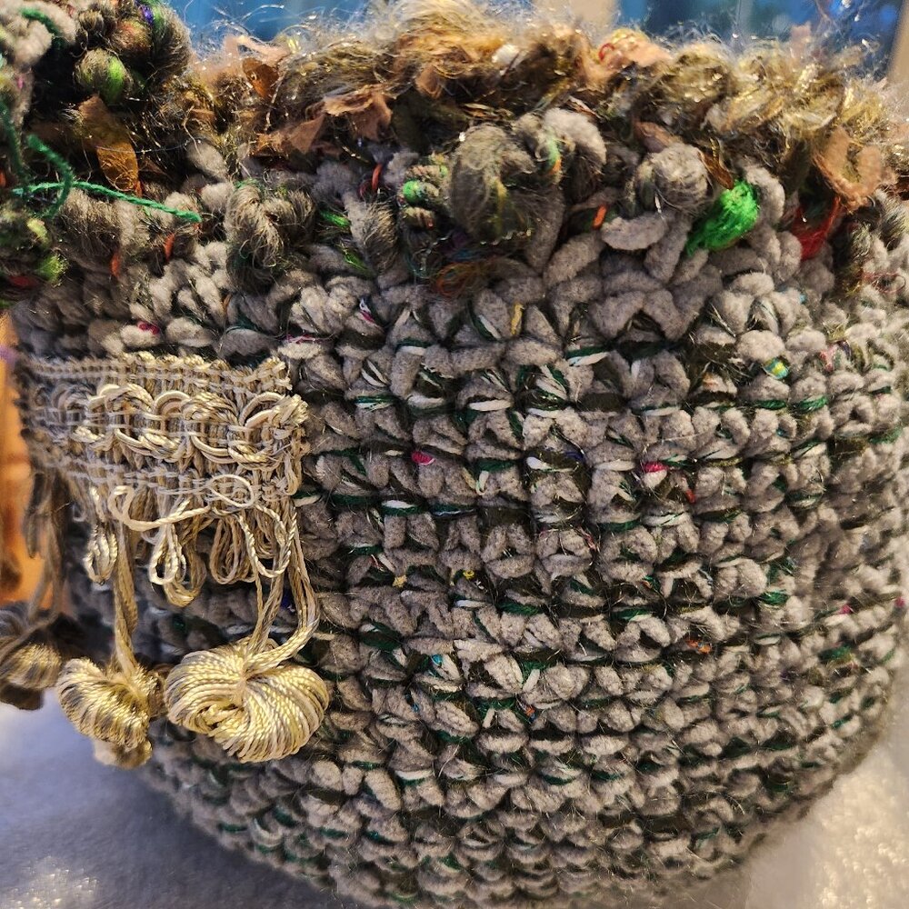 Basket, handmade, crocheted on wood base, with fringe and shines on the top.7in